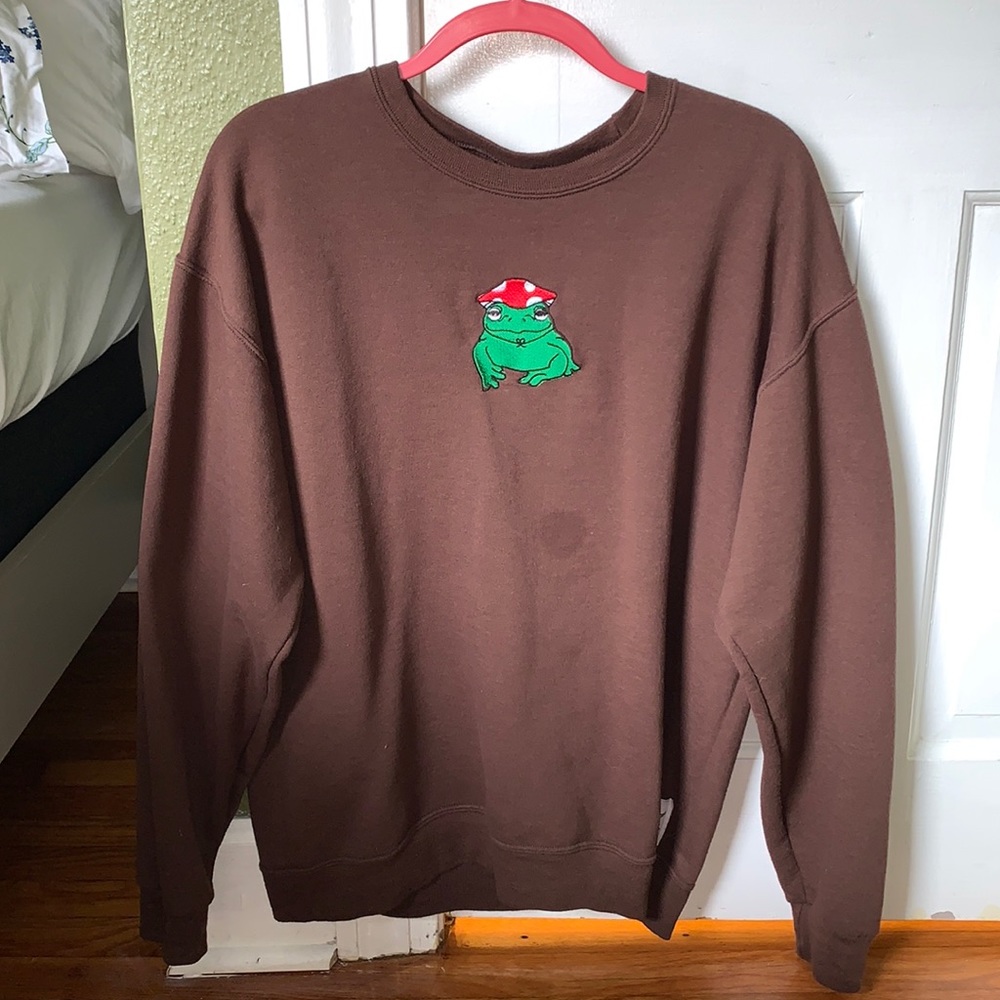 Dark brown crewneck with hand embroidered frog with mushroom hat